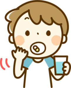 薬を飲む子供